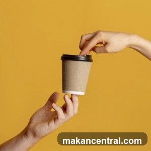 Hands holding a coffee cup