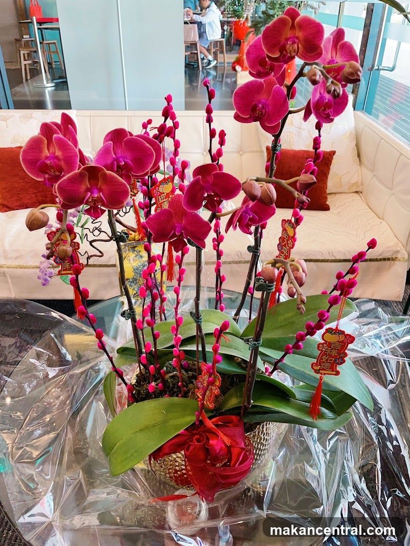 Orchid Arrangement with Festive Decorations