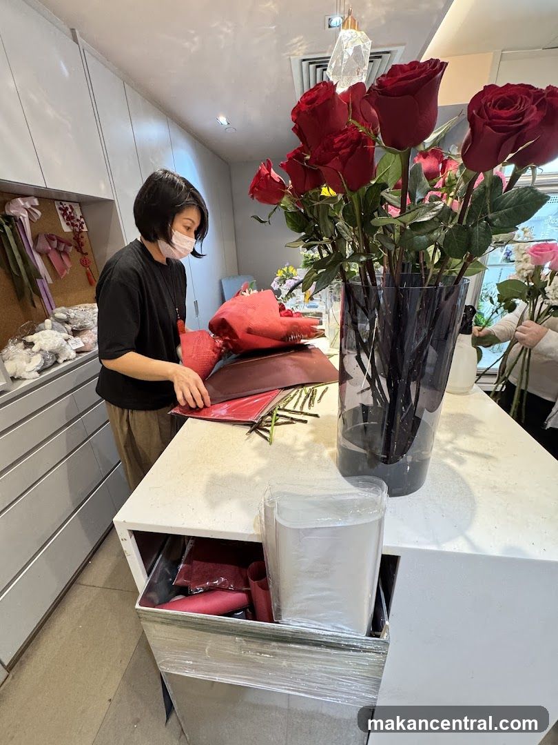 Florist arranging red roses