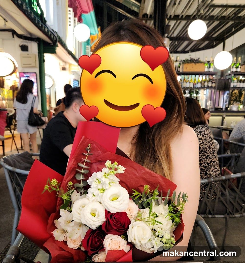 Woman Holding Flowers at Restaurant