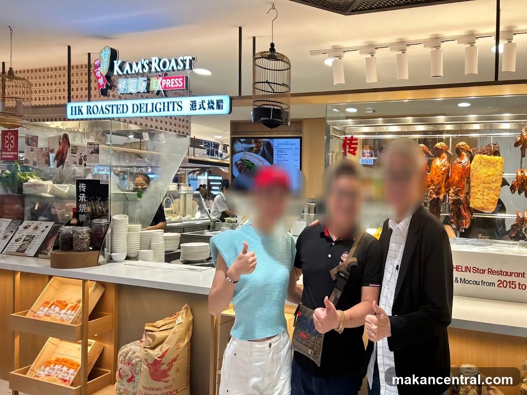 People in front of a roast duck restaurant