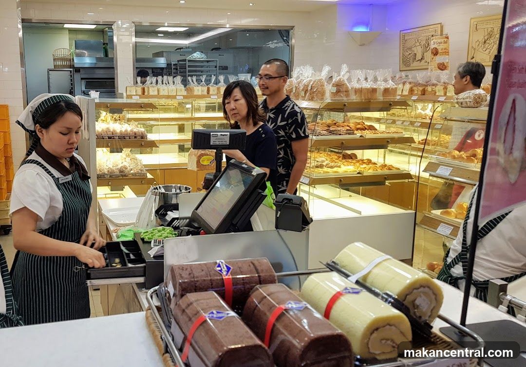 Bakery Counter with Staff and Customers
