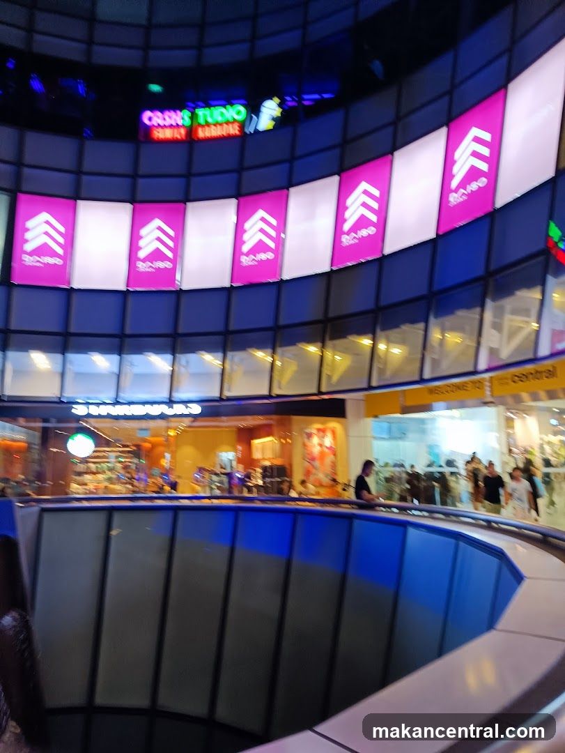 Interior of a shopping mall with various shops