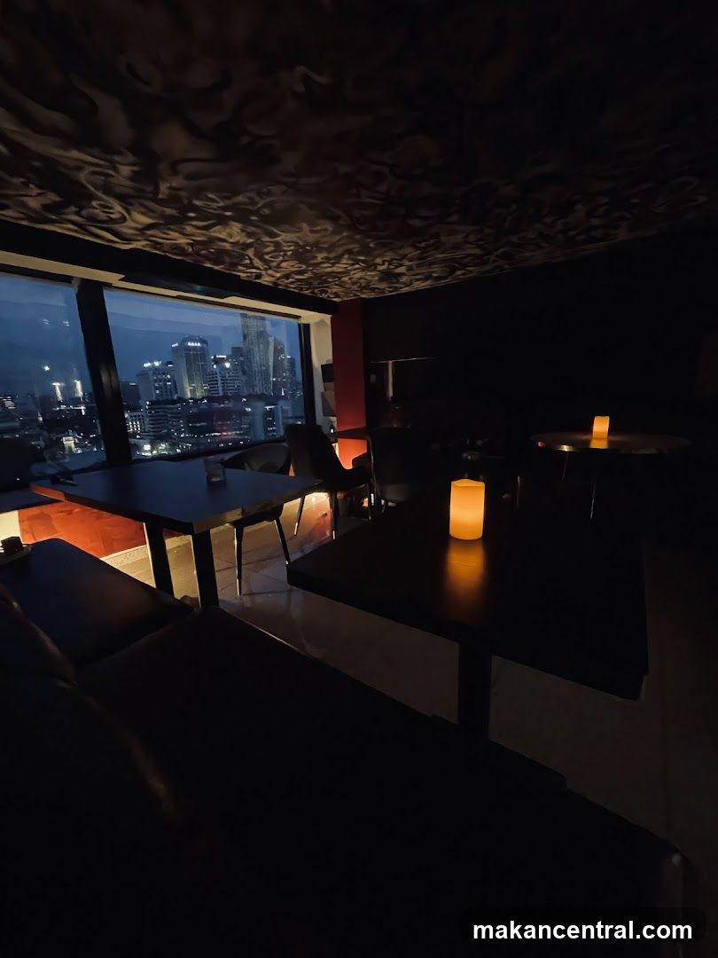 Dimly Lit Restaurant Interior with City View