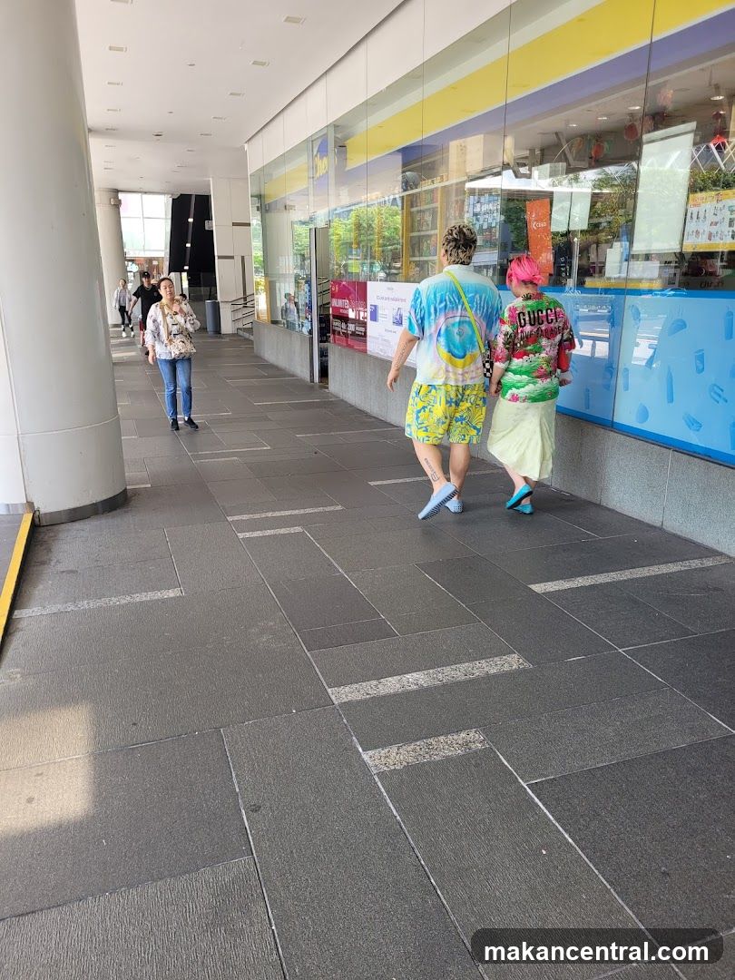People walking past a store