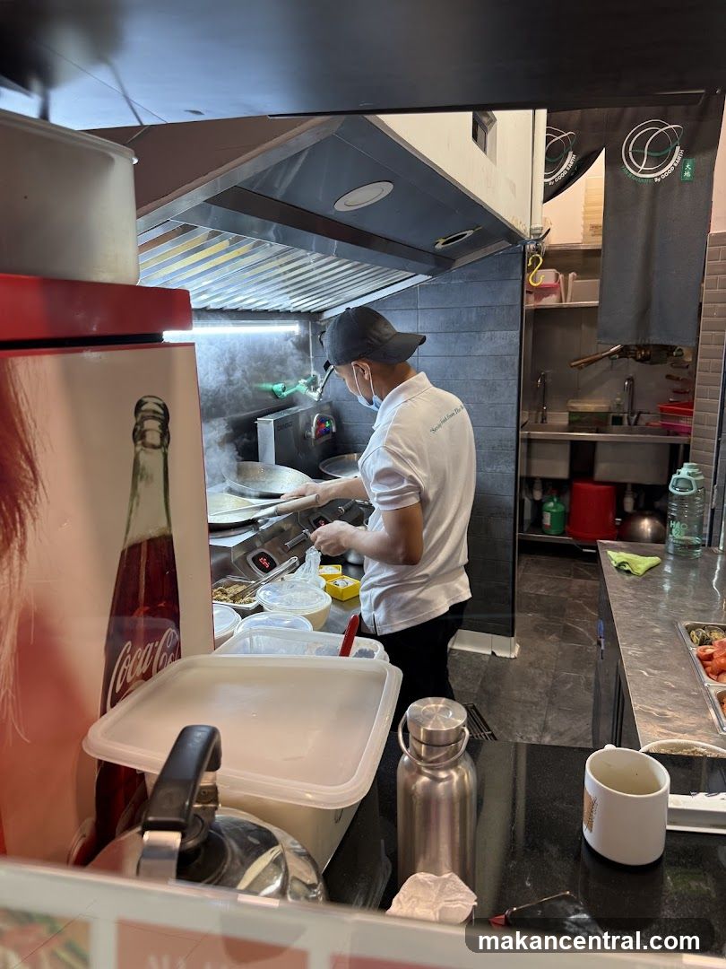 Chef Cooking in a Restaurant Kitchen
