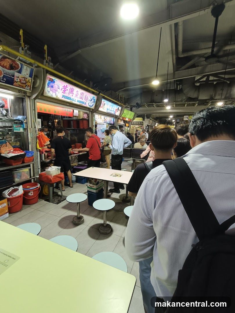 Busy Food Stall with Customers