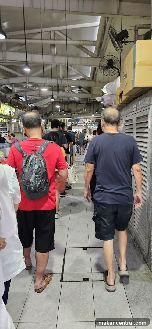 People queuing at a food stall