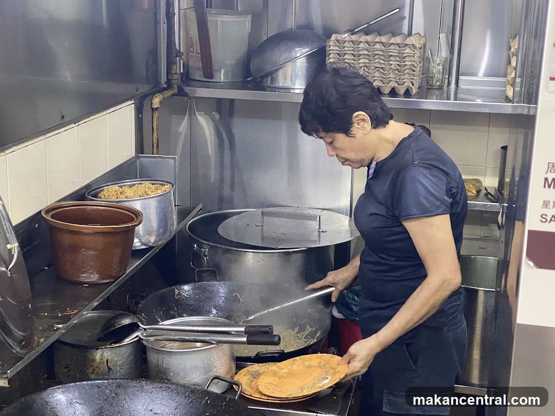 Cook preparing food in a kitchen