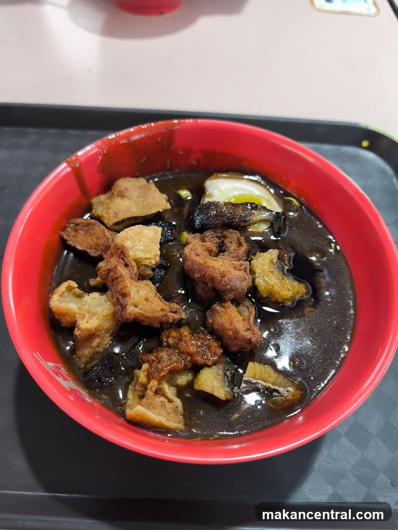 Bowl of Dark Soup with Toppings