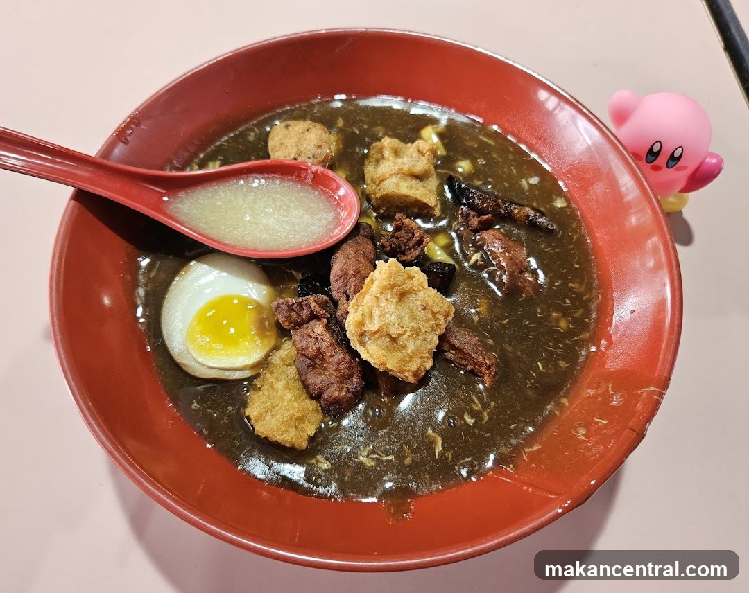 Bowl of Noodles with Egg and Fried Toppings