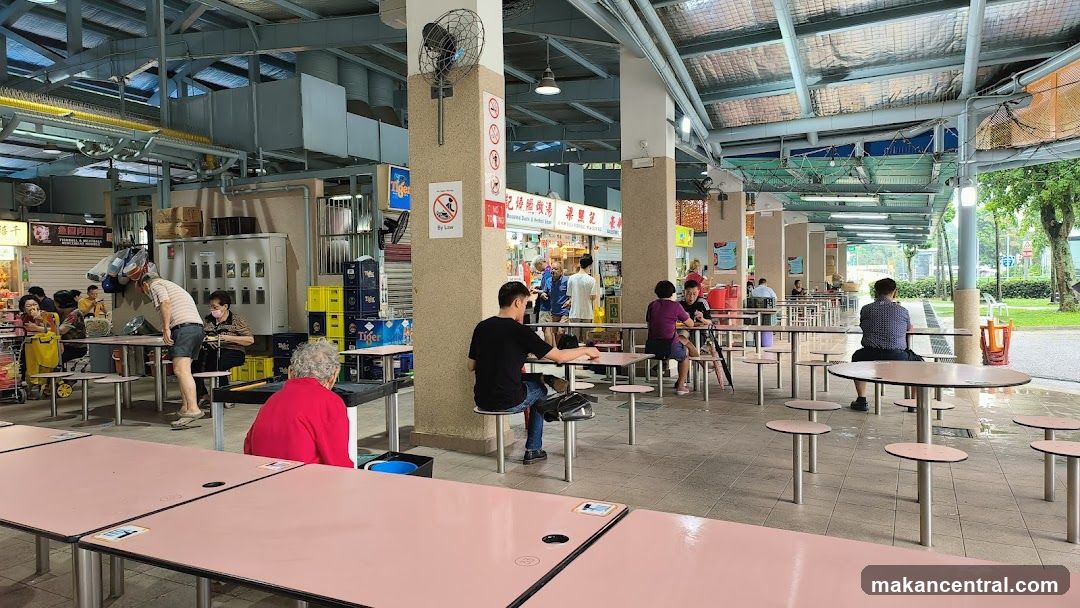 Outdoor Food Court with Tables and Stalls