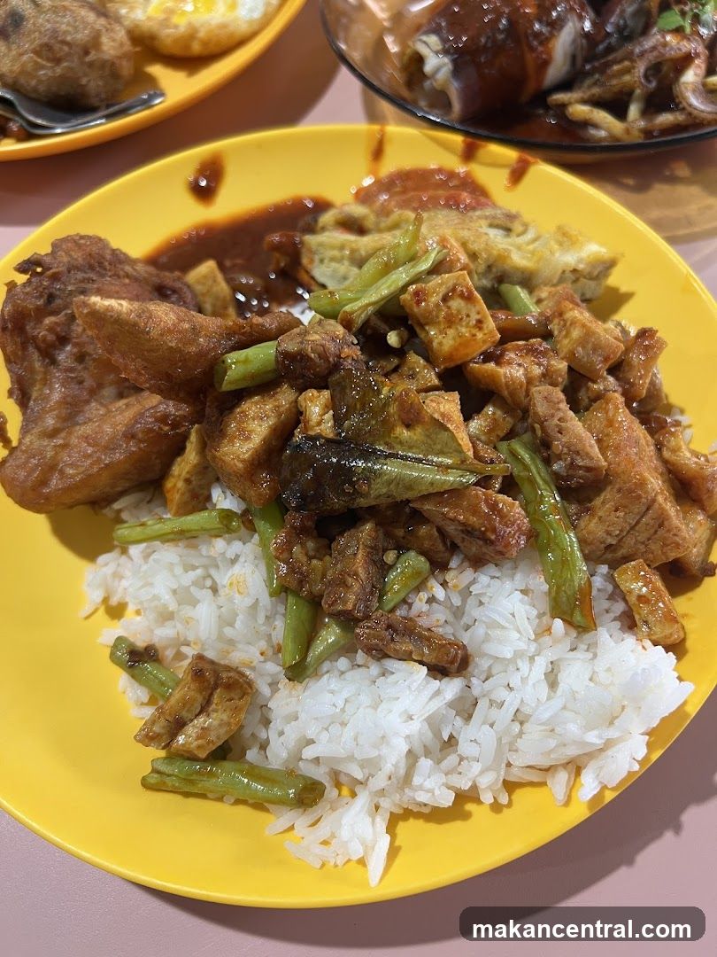 Plate of Rice with Fried Chicken and Stir-fried Tofu and Green Beans
