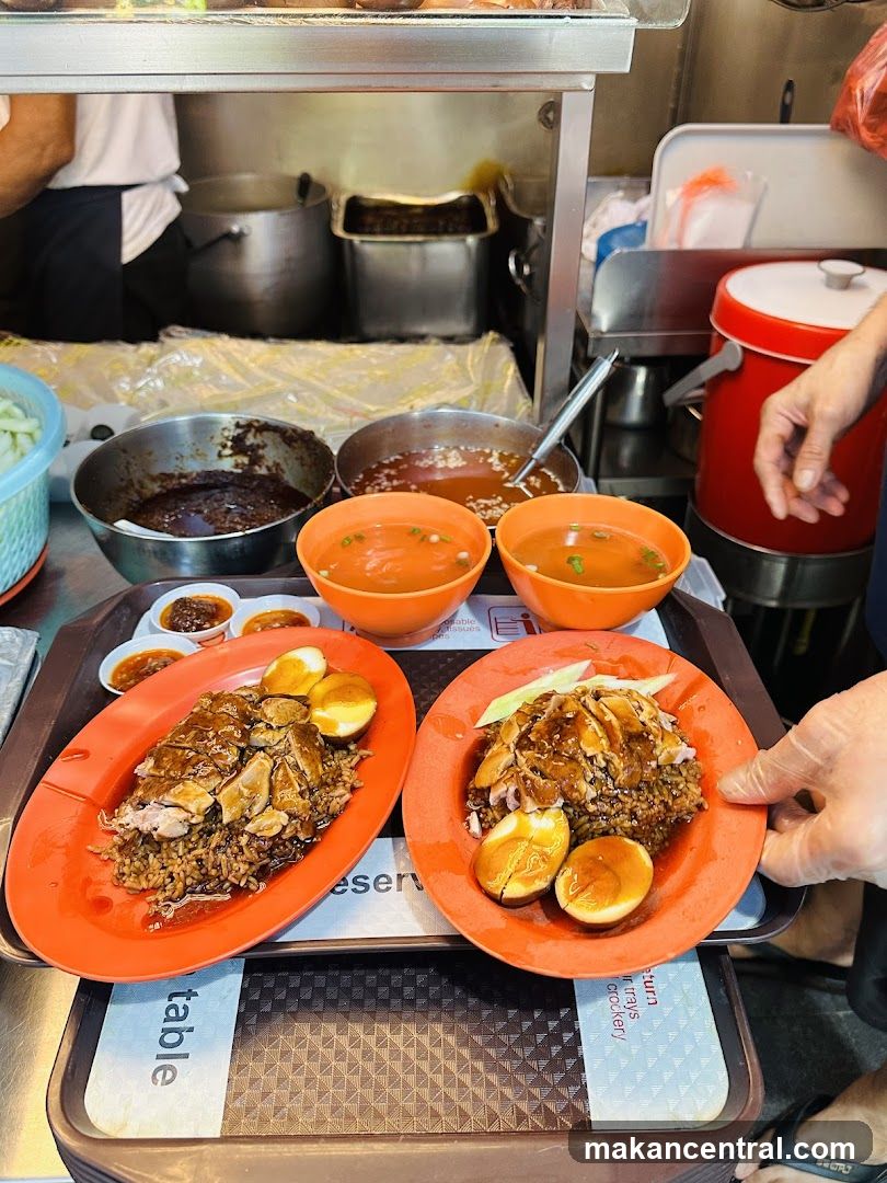 Two plates of rice with meat and eggs