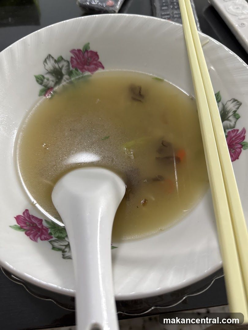 Bowl of Soup with Chopsticks