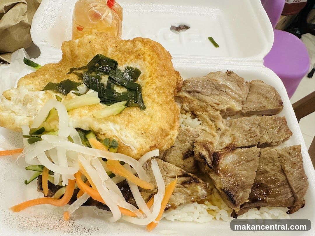 Rice plate with grilled meat and fried egg