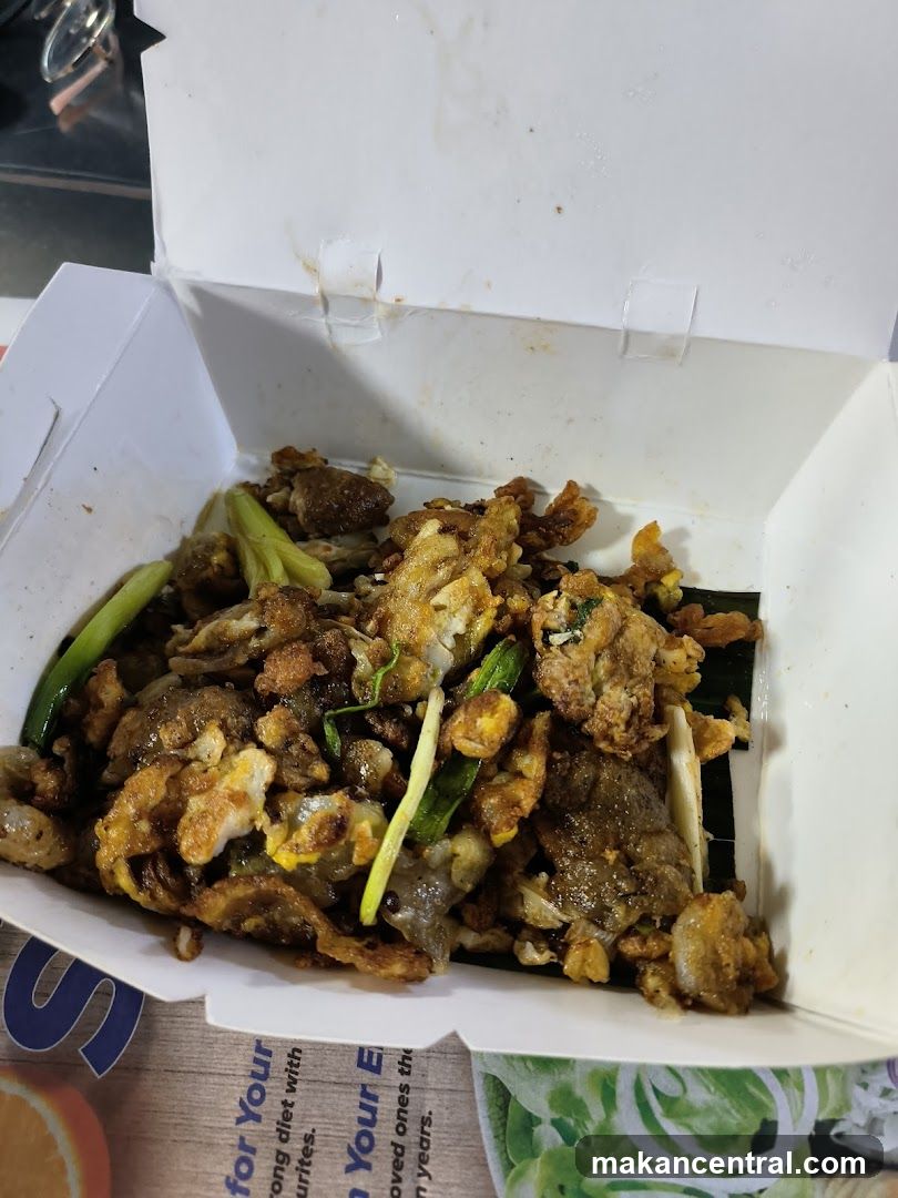 Oyster omelet in a takeout box