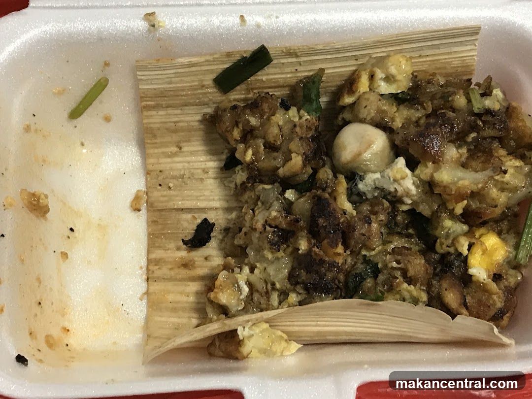Oyster omelet in a takeout container