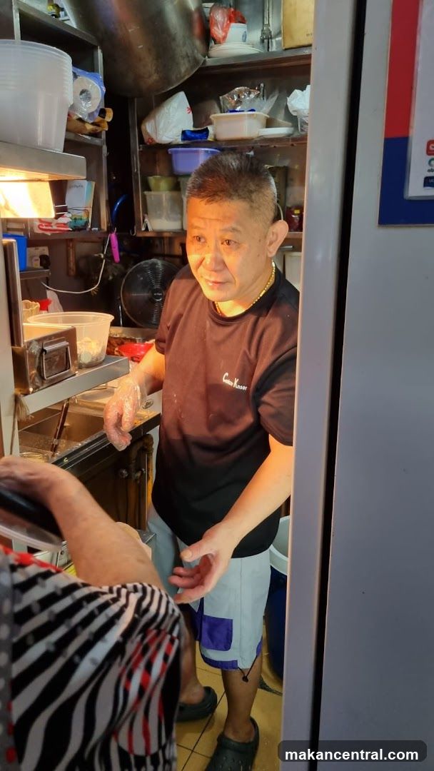 Man working in a food stall