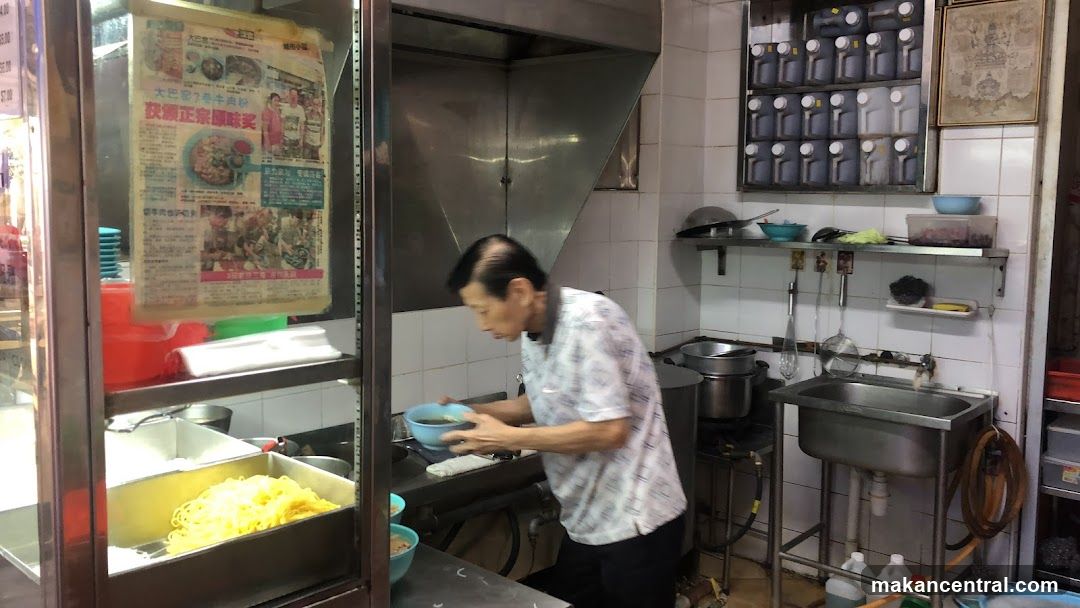 Kitchen Scene with Man Preparing Food
