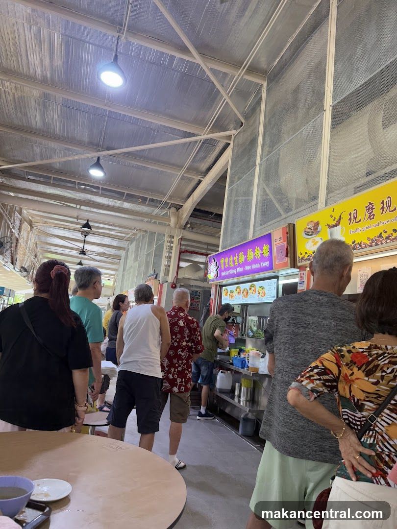 People queuing at a food stall