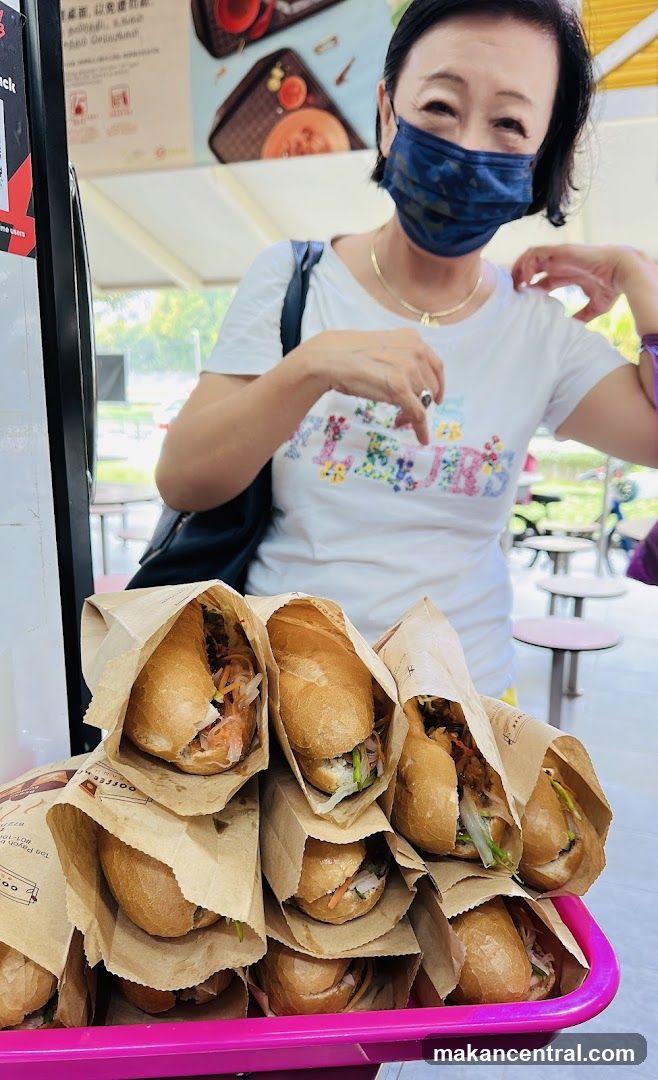 Woman with Banh Mi Sandwiches