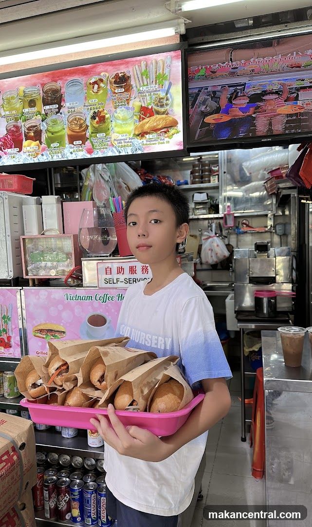 Boy holding tray of sandwiches
