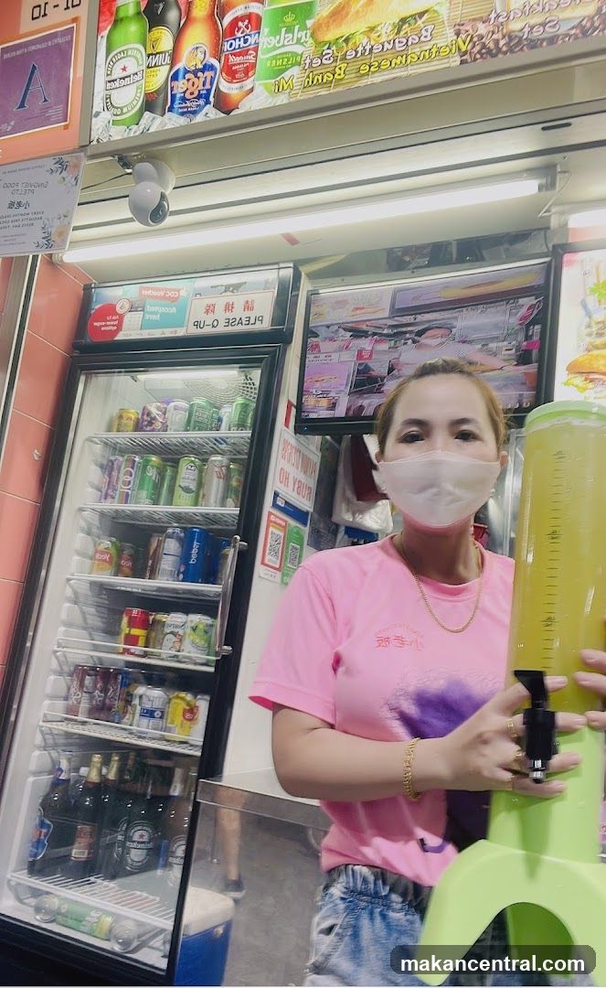 Woman holding a drink dispenser