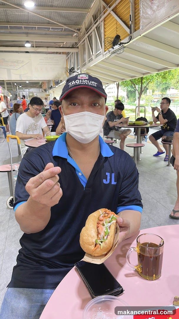 Man with a sandwich and coffee