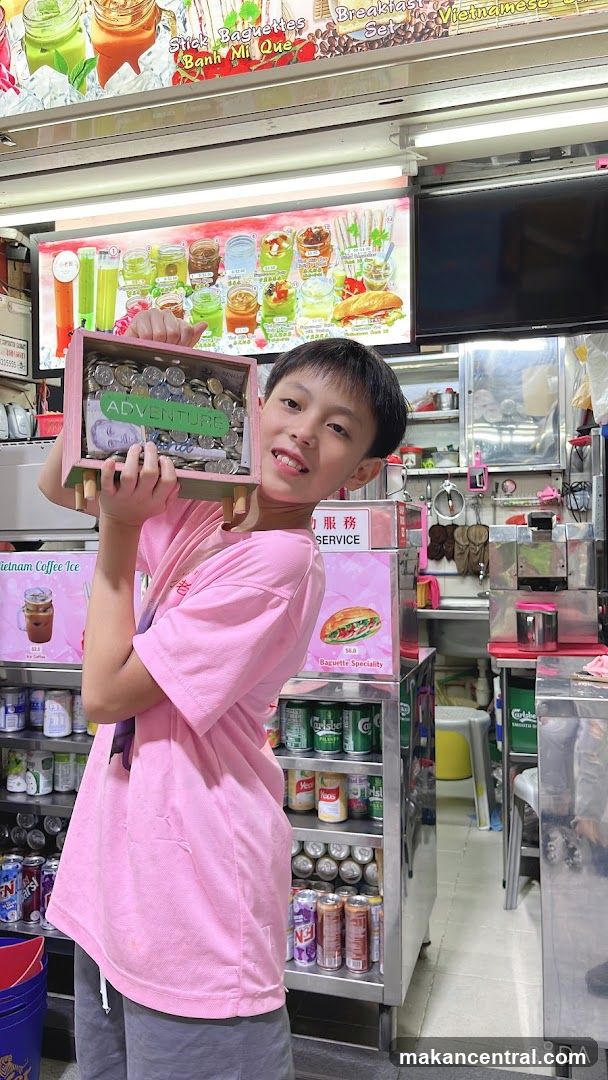 Boy holding a coin box