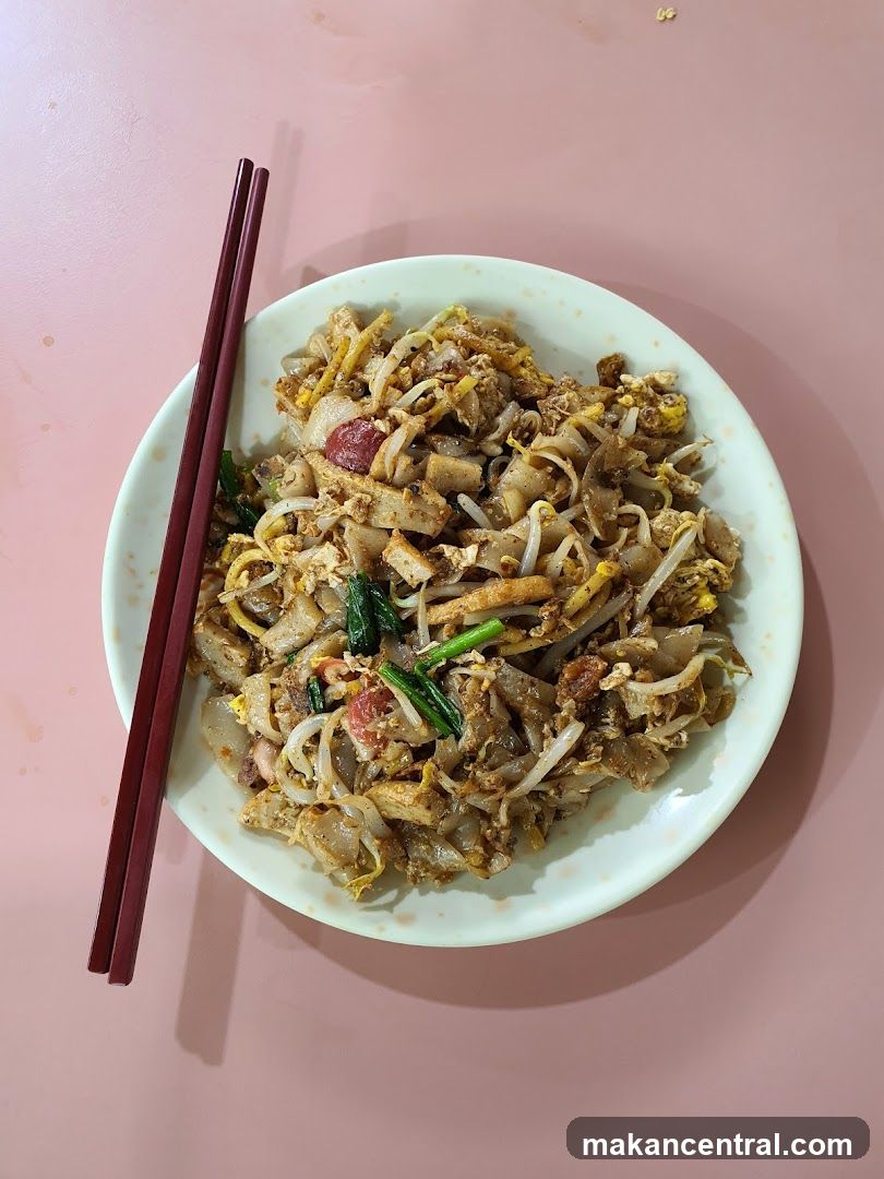Plate of Stir-Fried Noodles with Chopsticks