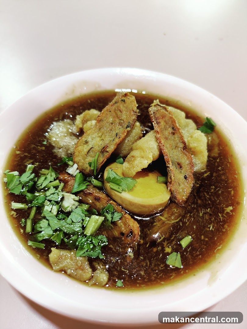 Braised Pork Belly with Egg and Fish Cake