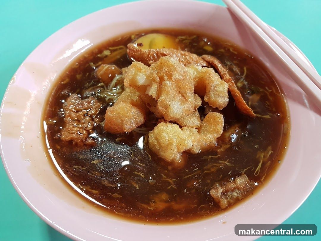 Bowl of Noodles with Fried Dough Fritters