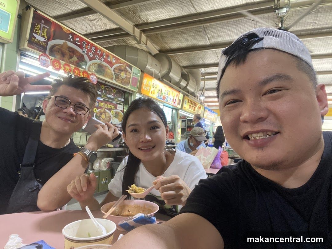 People eating at a food stall