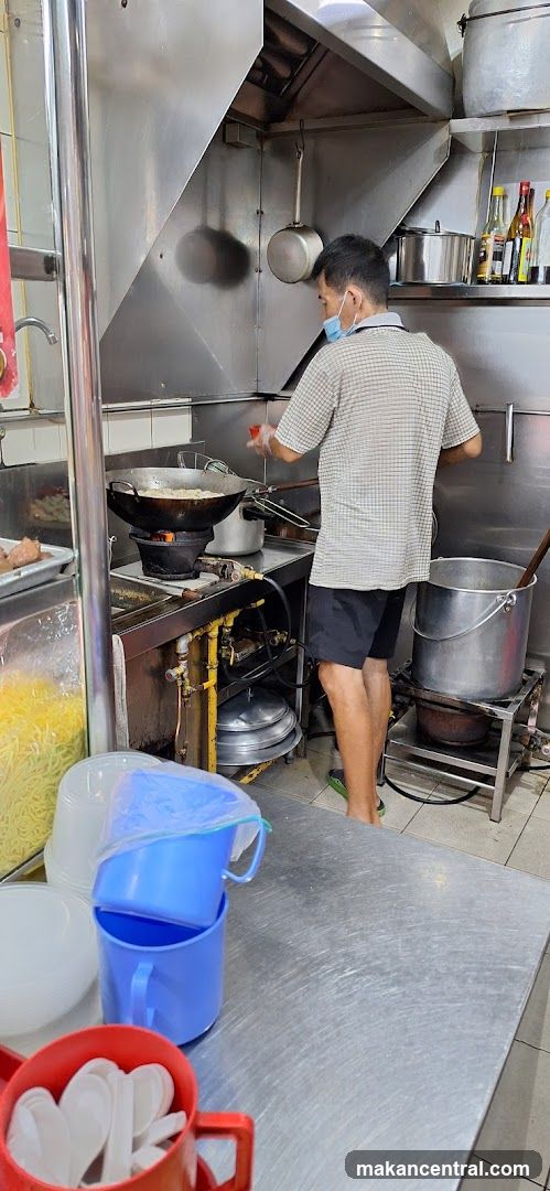 Cook preparing food in a commercial kitchen