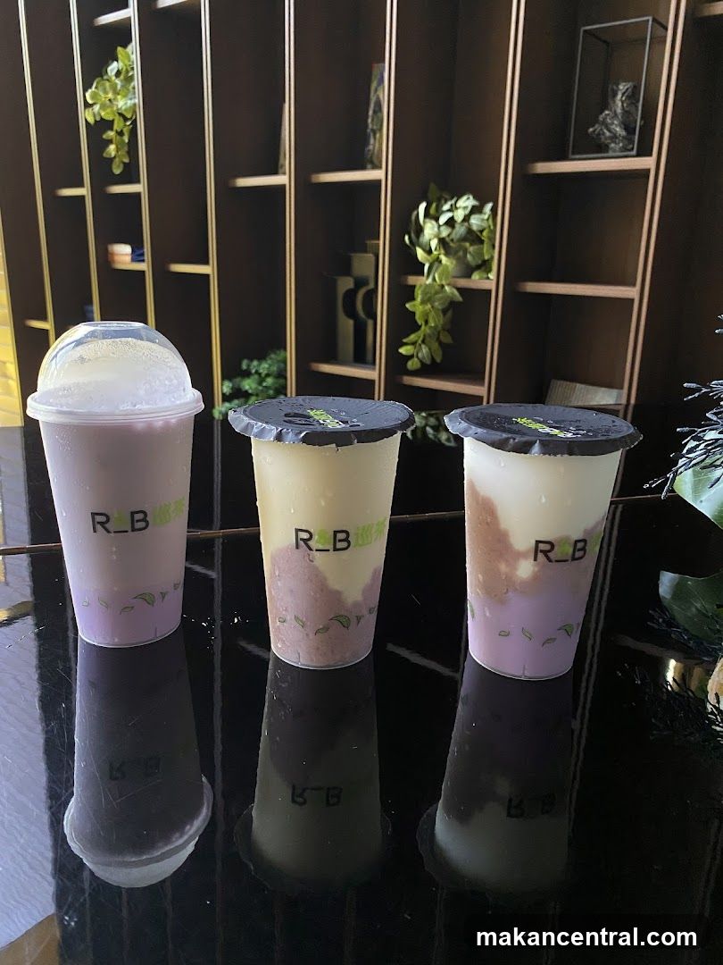 Three drinks on a reflective surface