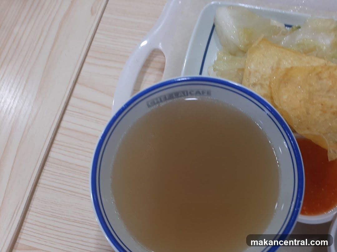 Bowl of Broth with Side Dishes
