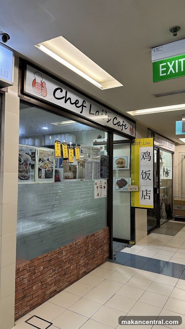 The exterior of a cafe with a sign that says "Chef Lai's Cafe" and a cartoon chef giving a thumbs up. There are menus and pictures of food displayed on the window.