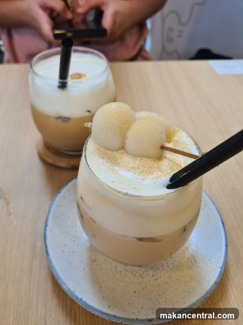 Two iced drinks with cream topping