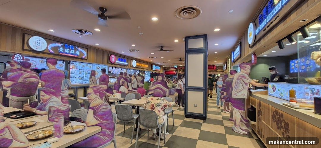 Food court with various stalls and diners