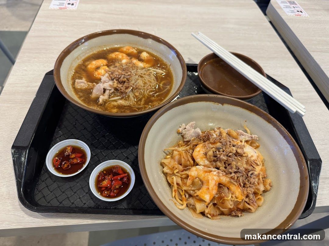 Two bowls of noodles with shrimp