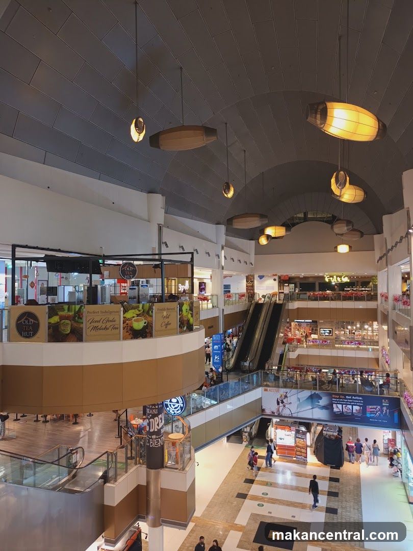 Mall Interior with Shops and Escalators