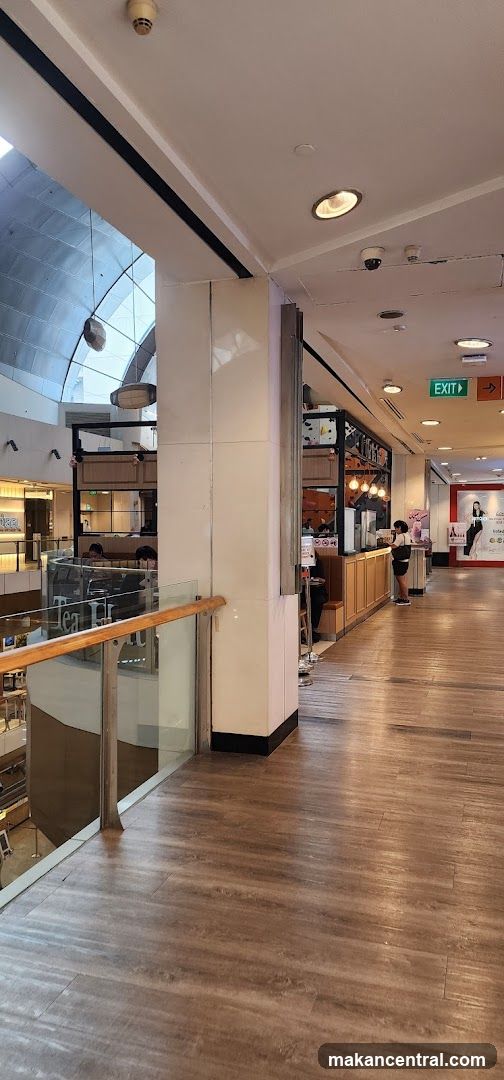 Indoor shopping mall corridor with a cafe