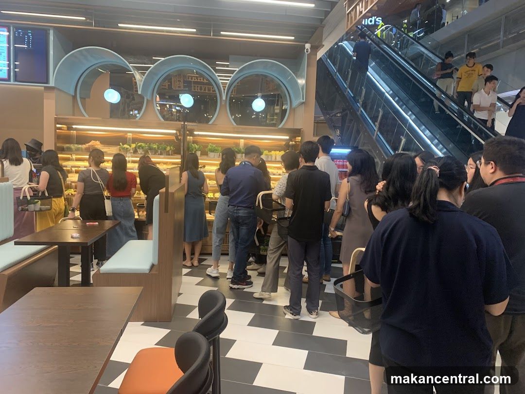People queuing at a bakery
