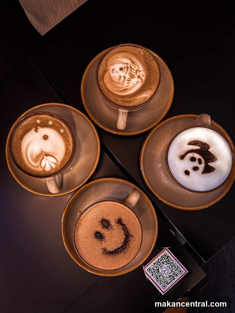 Four coffees with latte art