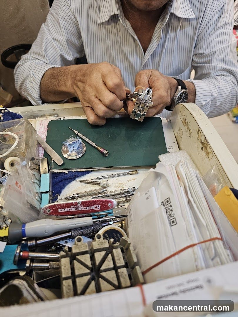 Watchmaker repairing a watch