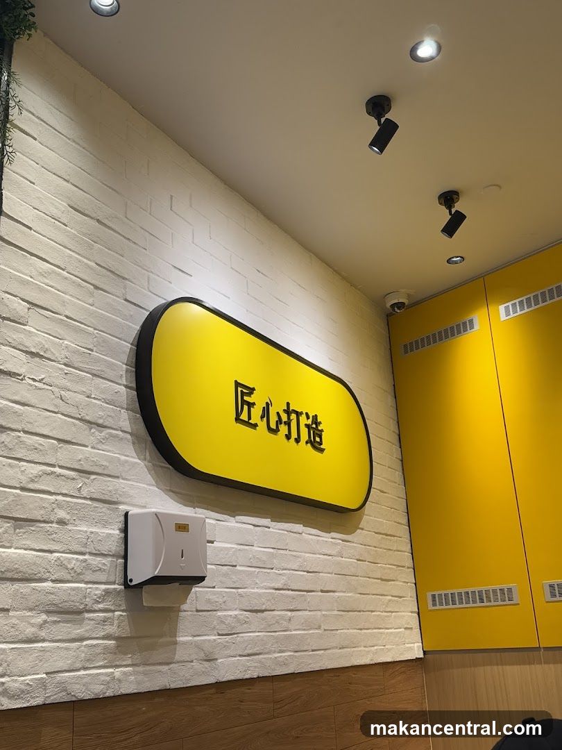 Yellow Signage on White Brick Wall