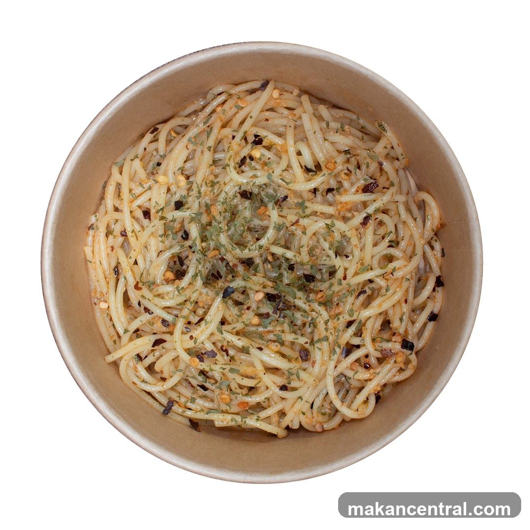 Spaghetti with chili flakes and herbs