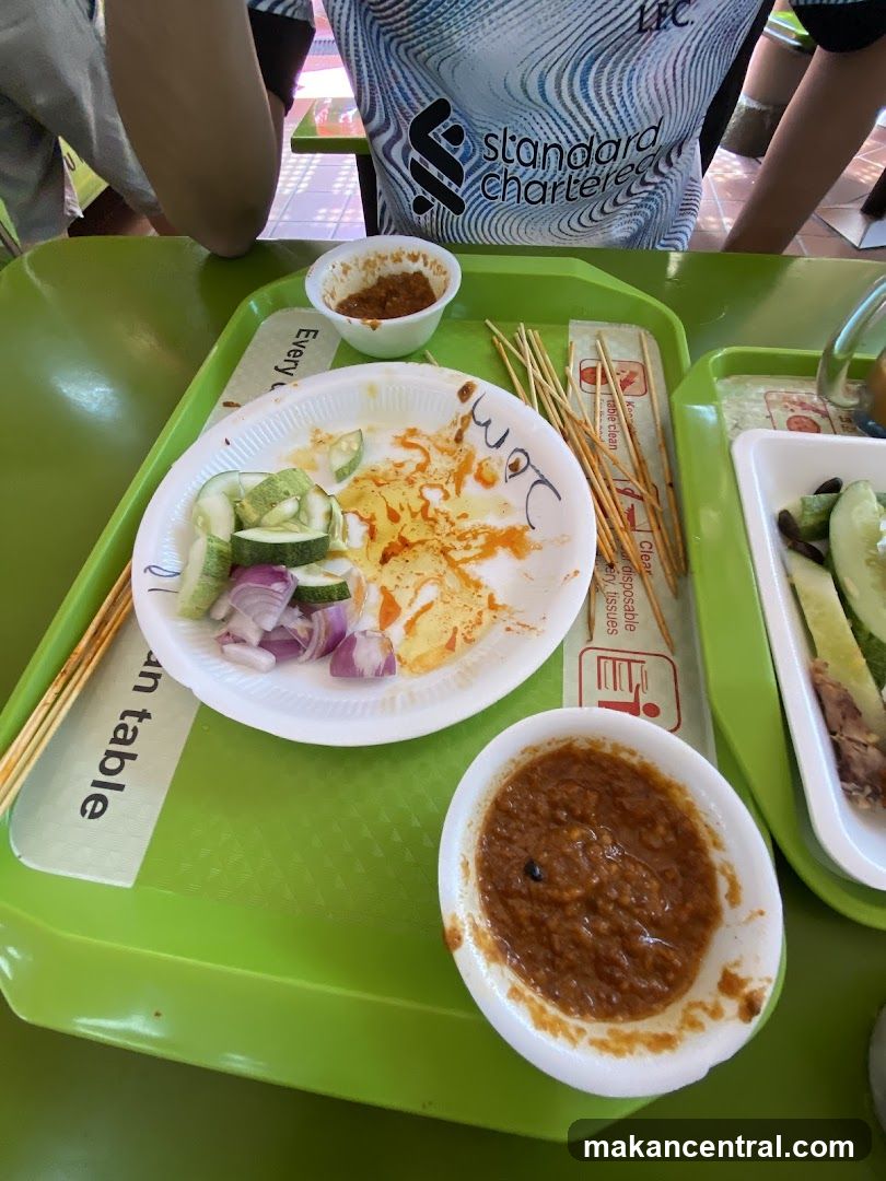 Food Tray with Satay Remnants