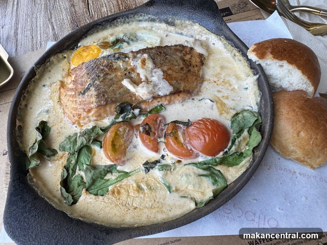 Salmon dish with bread rolls